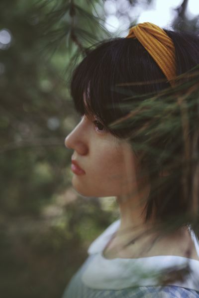 sad woman in a forest